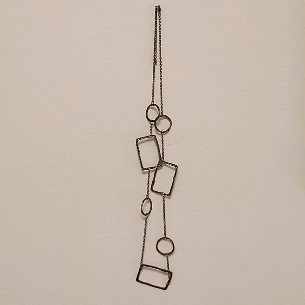 Brass hammered detail asymmetrical necklace. 16" in length.